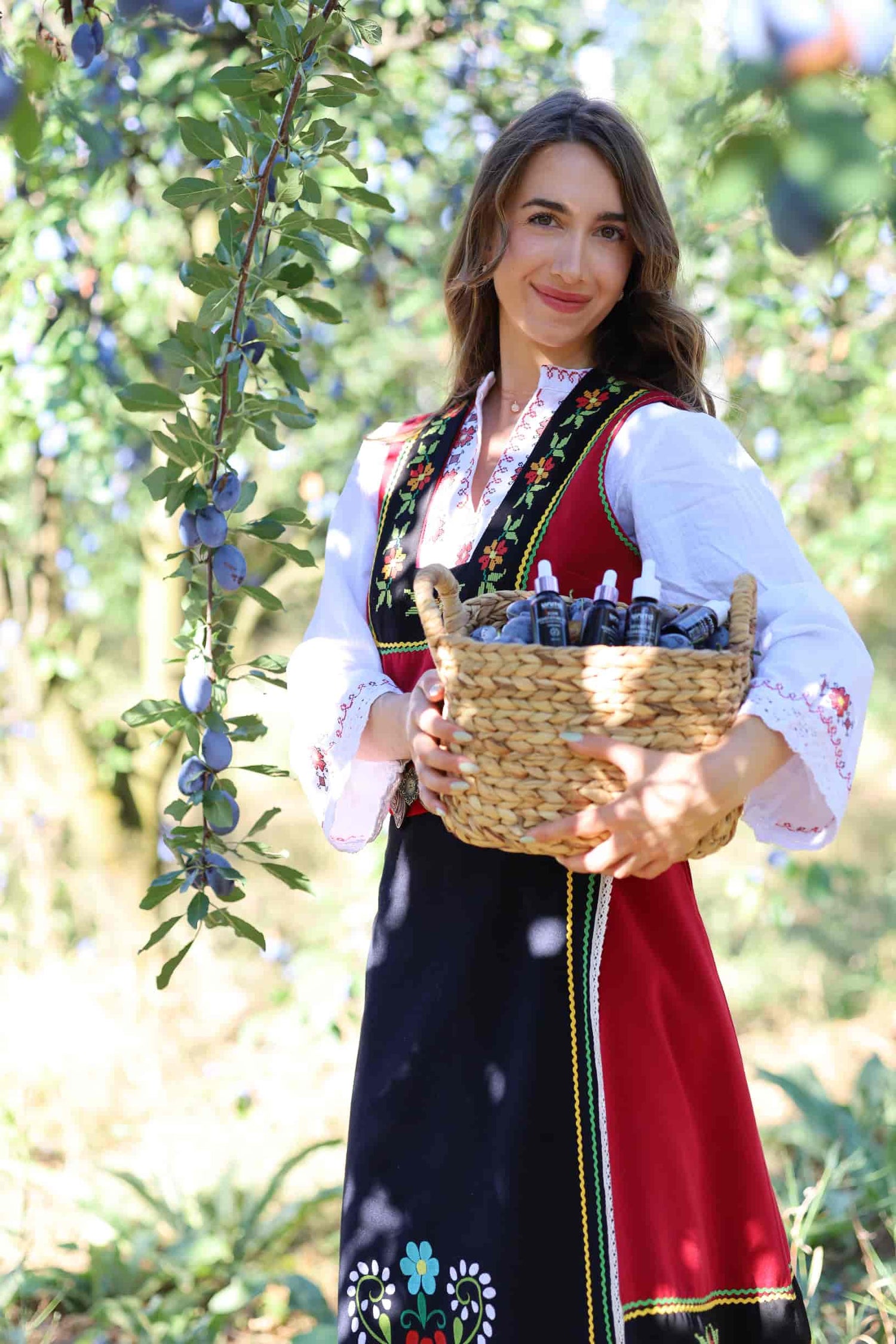 bulgarian traditinal clothing, plums, plum harvest, bulgarian girl